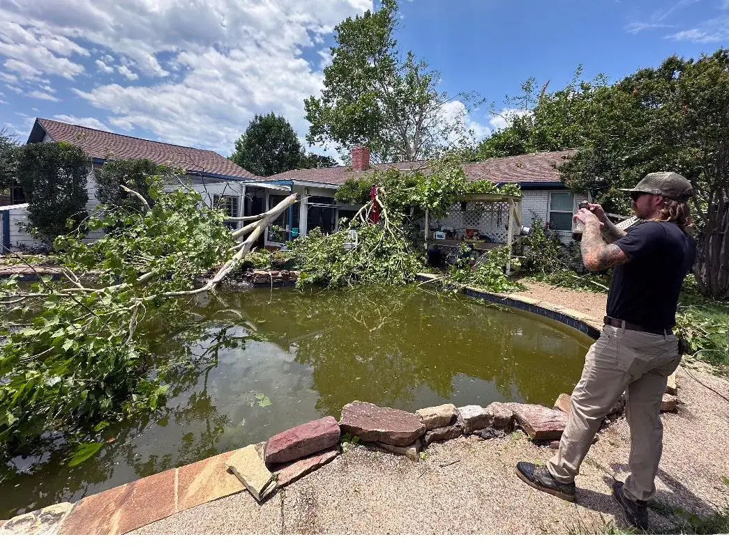 Storm-damaged pool area documented during a claim inspection